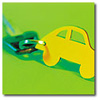 Yellow car shaped key ring on a green background with one key attached 